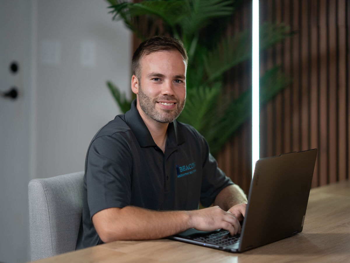 Tom Chisholm working at his desk